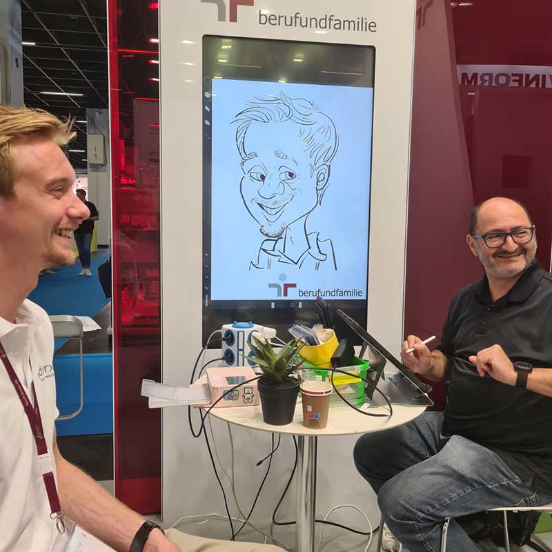 iPad Karikaturen am Stand von berufundfamilie Zukunft Personal in Köln